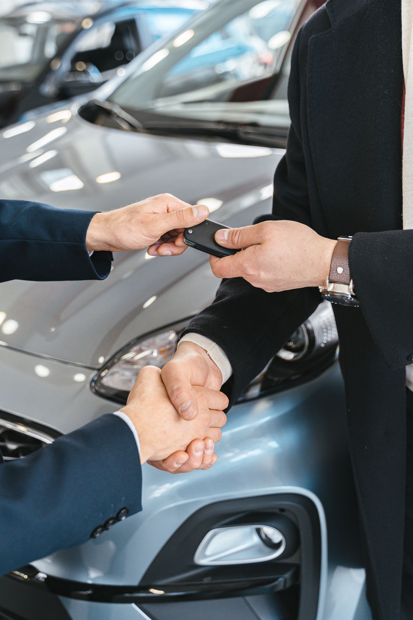 Car keys being presented during a gifted vehicle handoff
